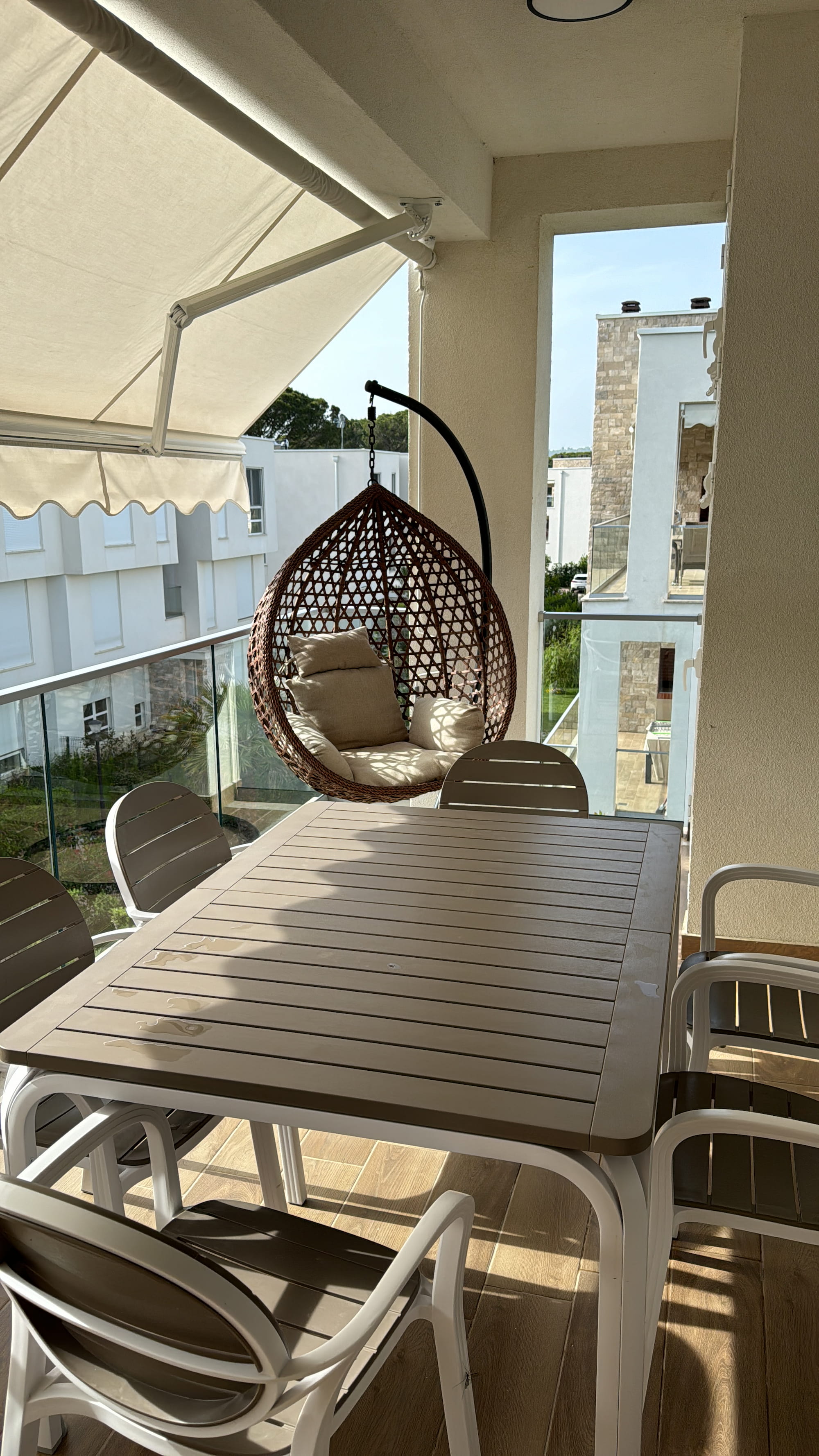 Private balcony with hanging egg chair
