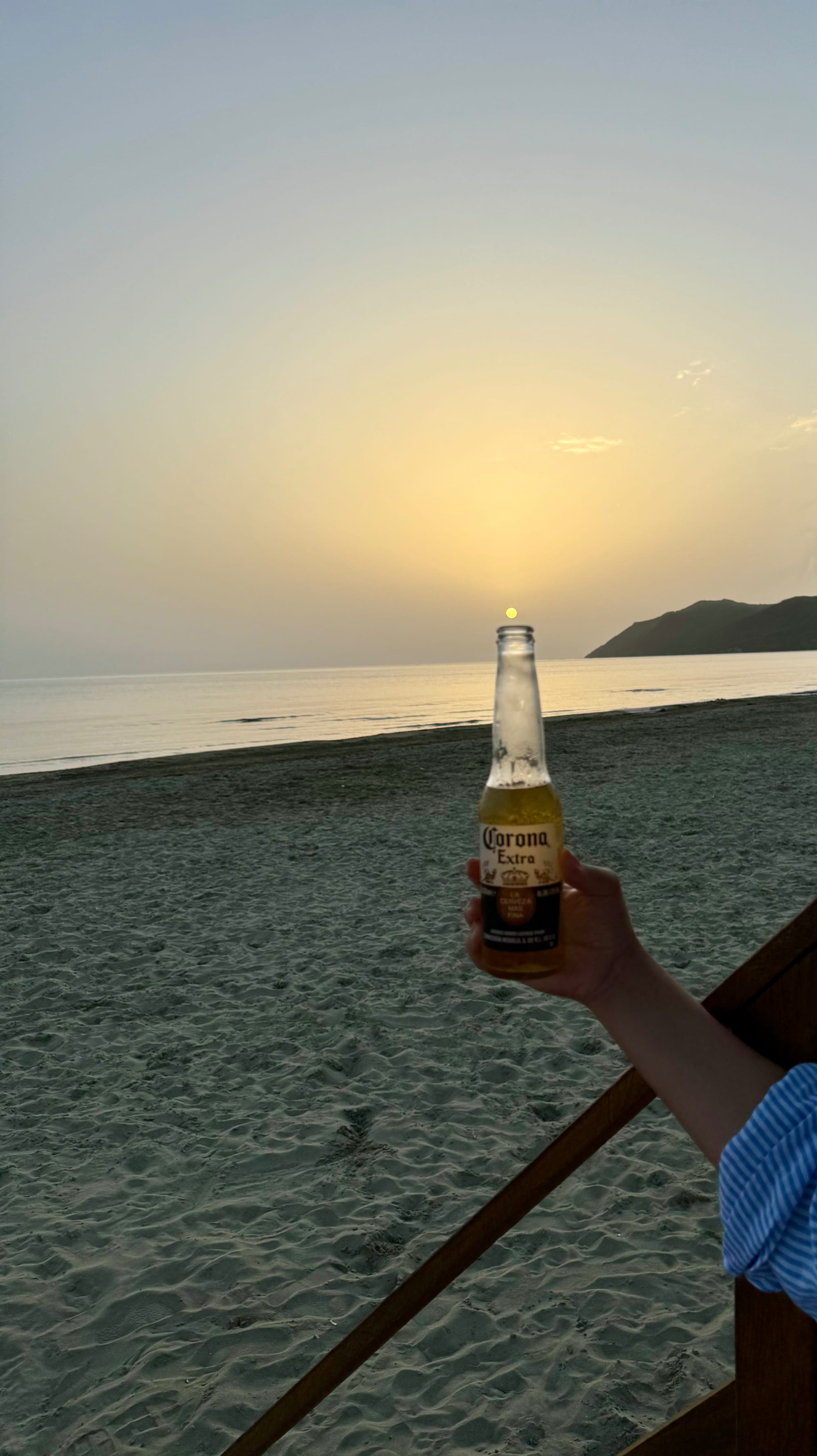 Beer at sunset on the beach in Lalzi Bay